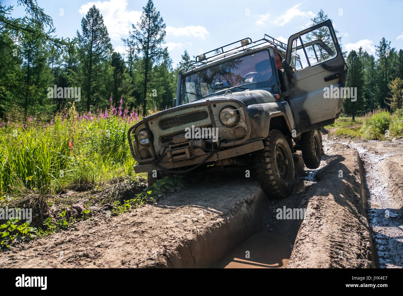 Suv Stuck In A Rut On A Bad Impassable Road In The Woods Of Siberia Russia Stock Photo Alamy
