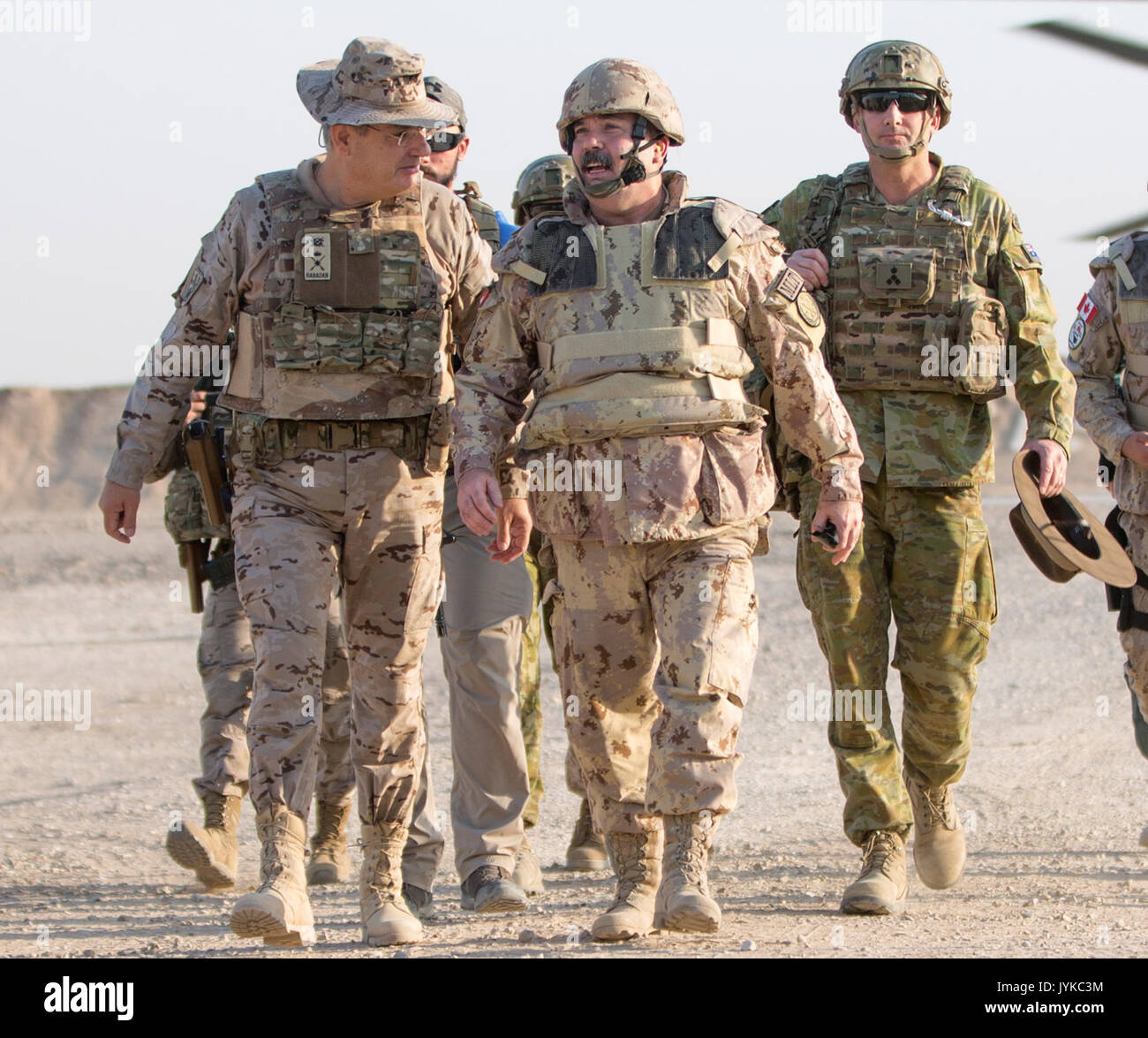 Spanish army Brig. Gen. D. Luis Martín-Rabadán, Commander Task Force Besmayah, left, walks with Canadian Brig. Gen. Steve Whelan, Combined Joint Task Force-Operation Inherent Resolve, CJ7, center, and Australian Brig. Gen. Rupert Hoskin, Combined Joint Task Force-Operation Inherent Resolve, director CJ5, right, during a battlefield circuit at the Besmaya Range Complex, Iraq, August 9, 2017. The Besmaya Range Complex is one of four Combined Joint Task Force - Operation Inherent Resolve building partner capacity locations dedicated to training partner forces and enhancing their effectiveness on  Stock Photo