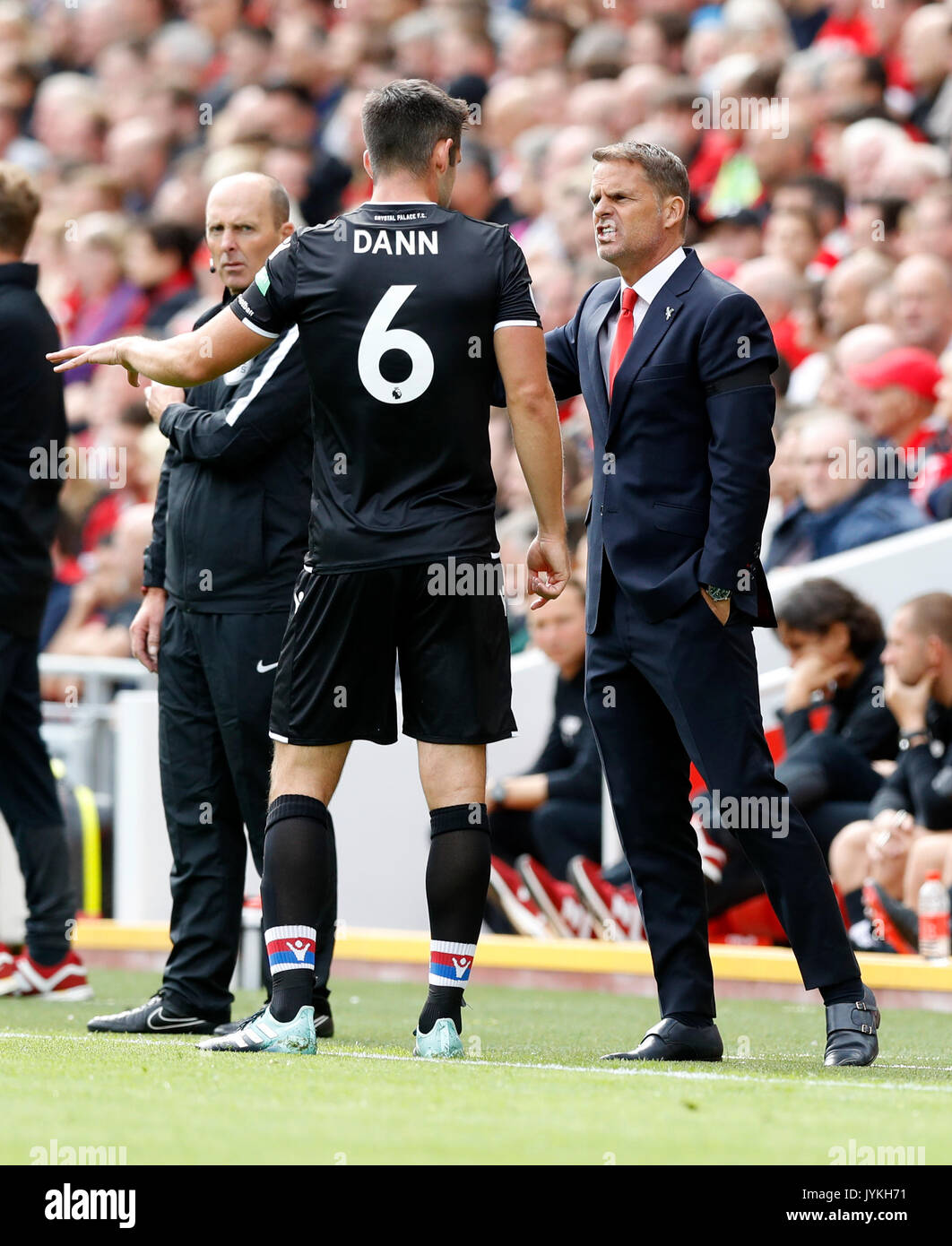 Crystal Palace manager Frank de Boer speaks to Scott Dann during the Premier League match at Anfield, Liverpool. Stock Photo