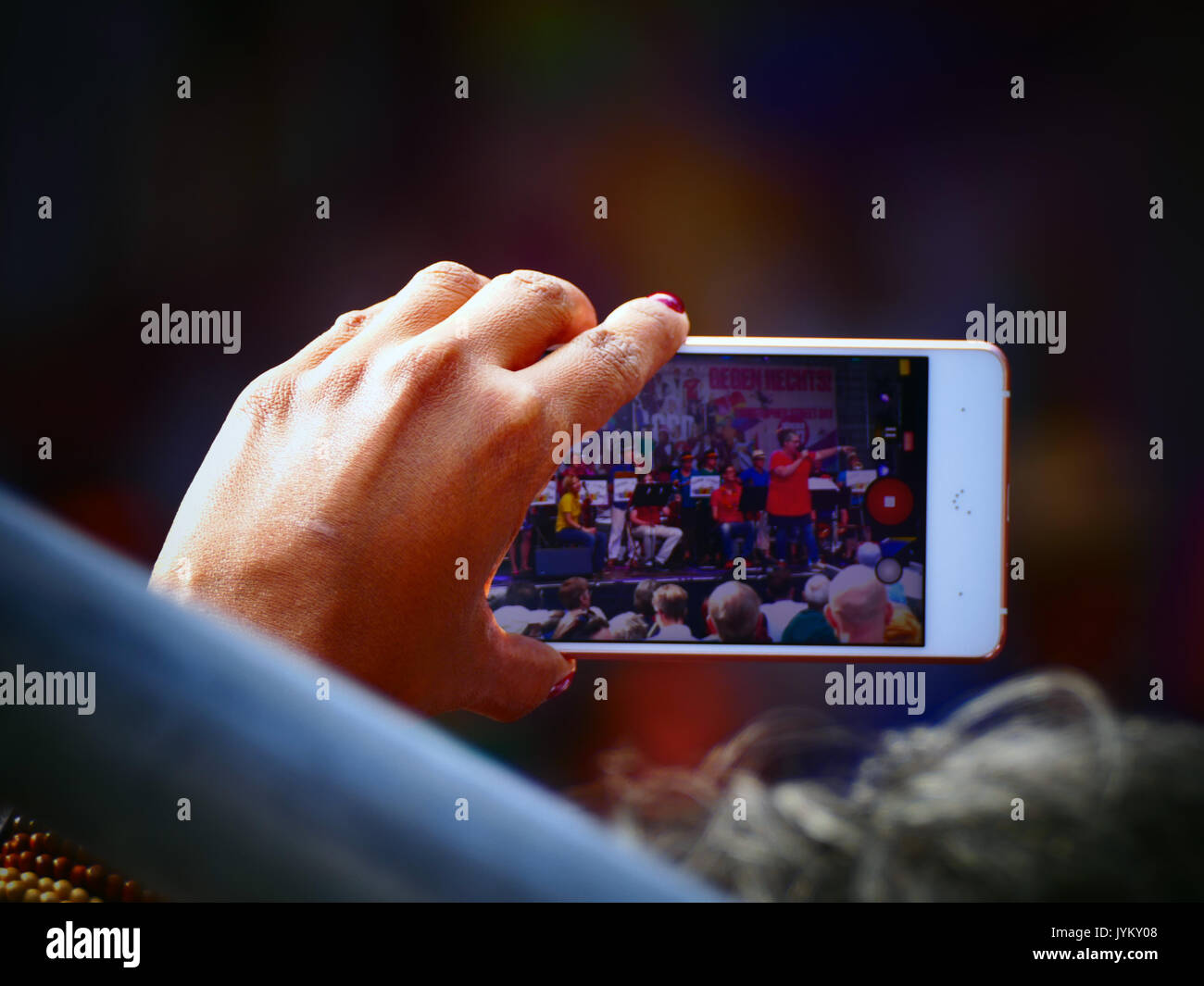Handheld smartphone filming Christopher's Street Day Marriage for All party concert celebration Stock Photo