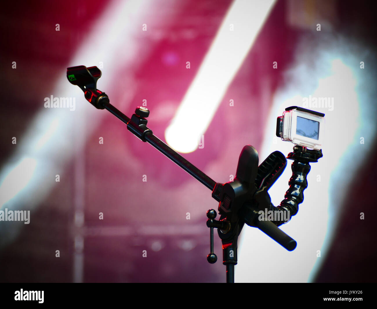 Sport camera on microphone stand filming concert Stock Photo