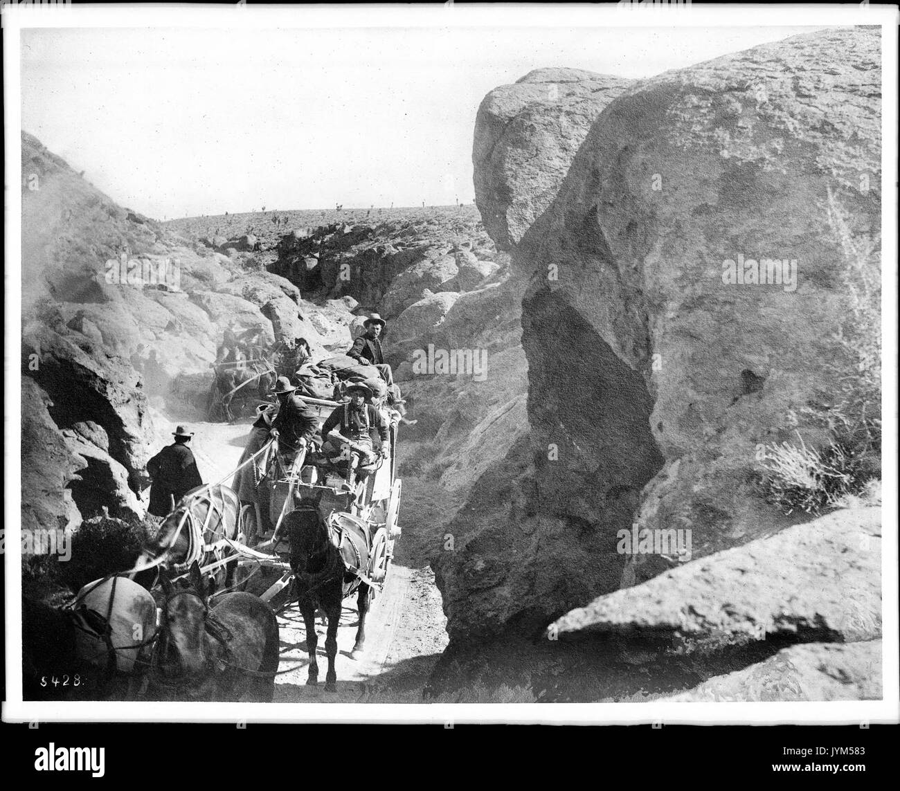 A desert stage going through a canyon heading towards Goldfield, Nevada, ca.1900 (CHS 5428) Stock Photo