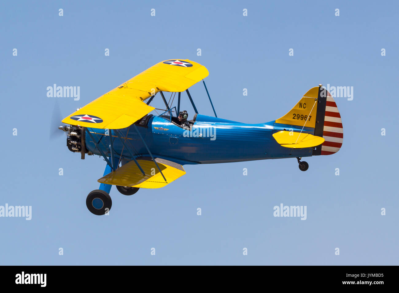 1940 Waco UPF-7 biplane in U.S Army markings in flight during the 2017 Nevada County Airfest Stock Photo