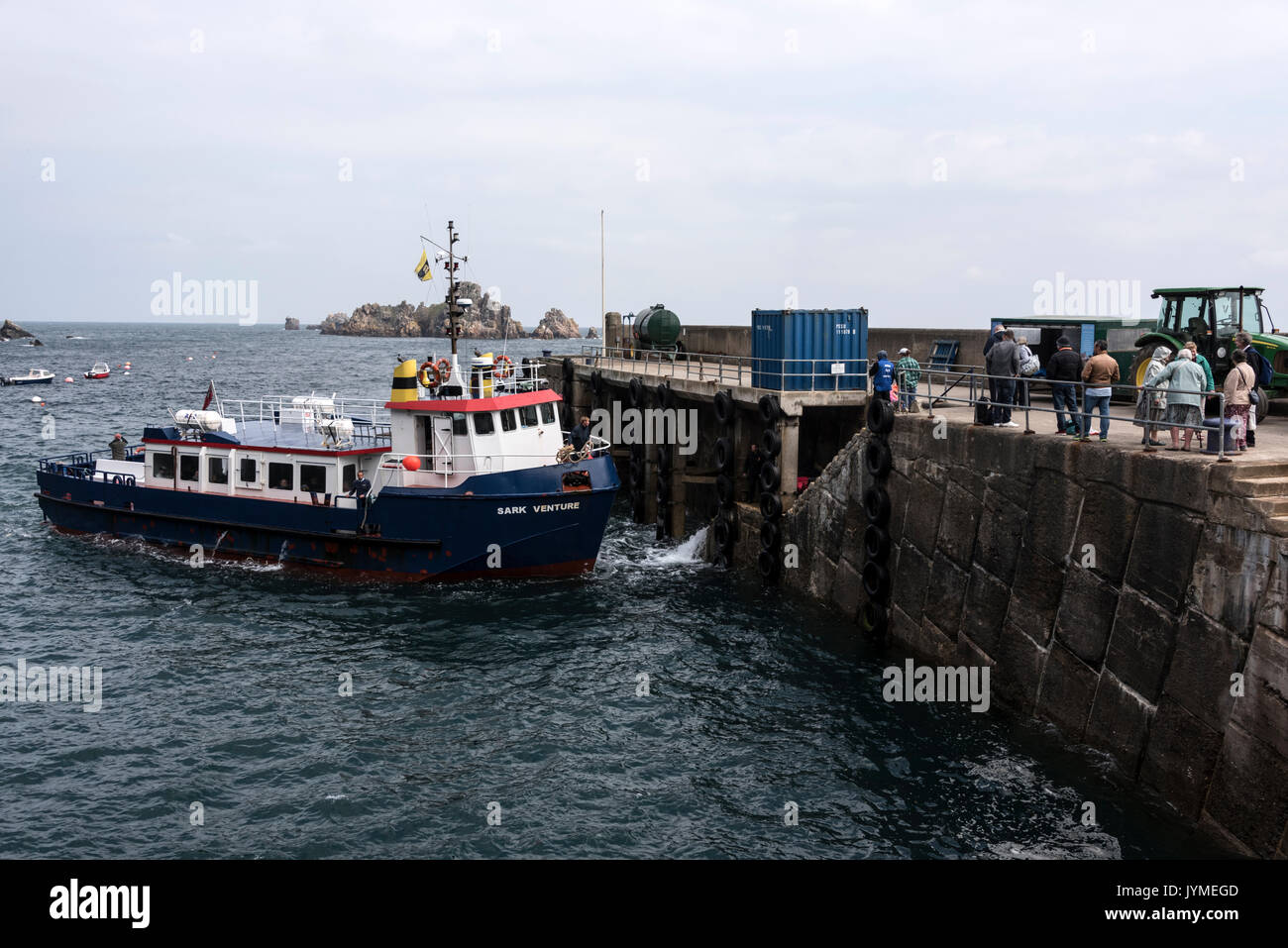A passenger ferry from Guernsey docks at Sark harbour on the Isle of Sark, Bailiwick of Guernsey in the Channel Islands, Britain Stock Photo
