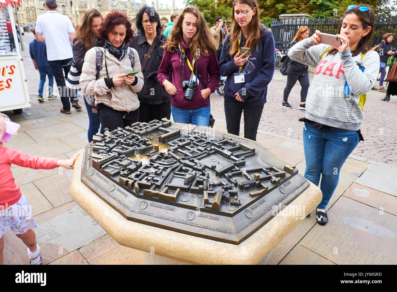 Tourists Looking At The City Centre Scale Model Map, Kings Parade, Cambridge, UK Stock Photo