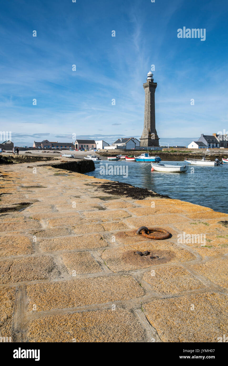 Lighthouse with pier and boats. Penmarch, Finistère, Brittany, France. Stock Photo