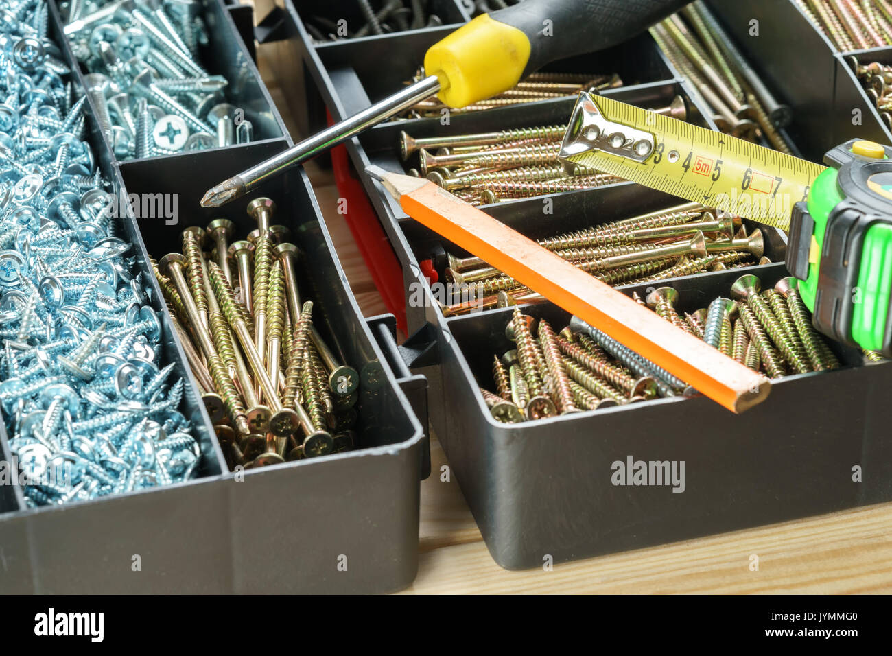 Many Screws In Plastic Organizer Box Top View Stock Photo