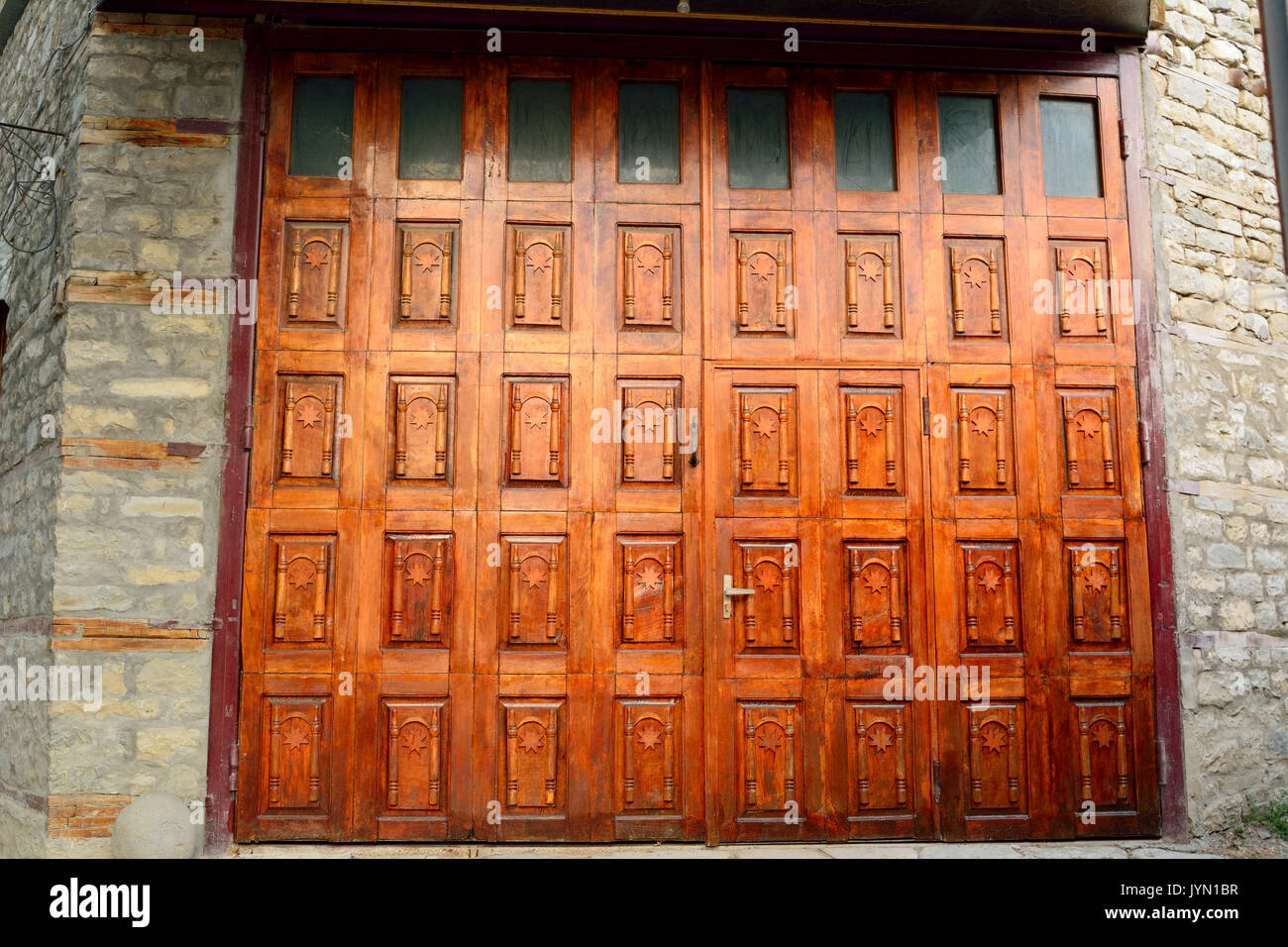 Wooden multi-paneled door in Lahic village in Azerbaijan. Stock Photo