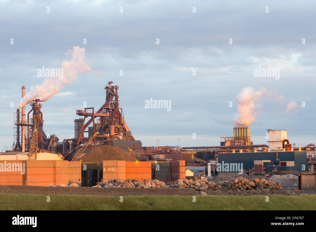Old steel factory with smokestacks and chimney emissions Stock Photo