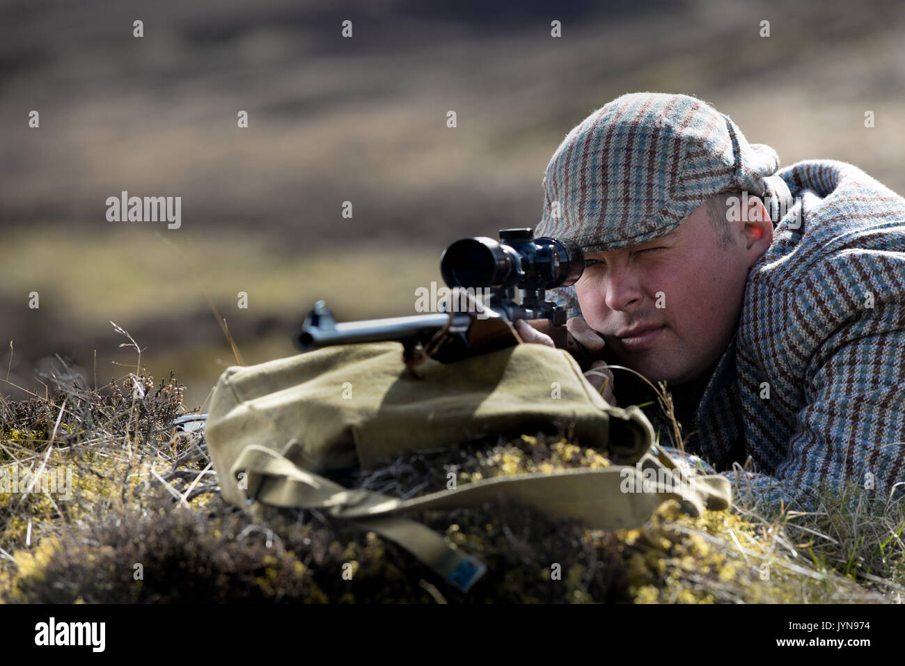 Deer stalking on the Blair Atholl estate in Scotland armed with the Rigby Stalker rifle with a telescopic sight Stock Photo