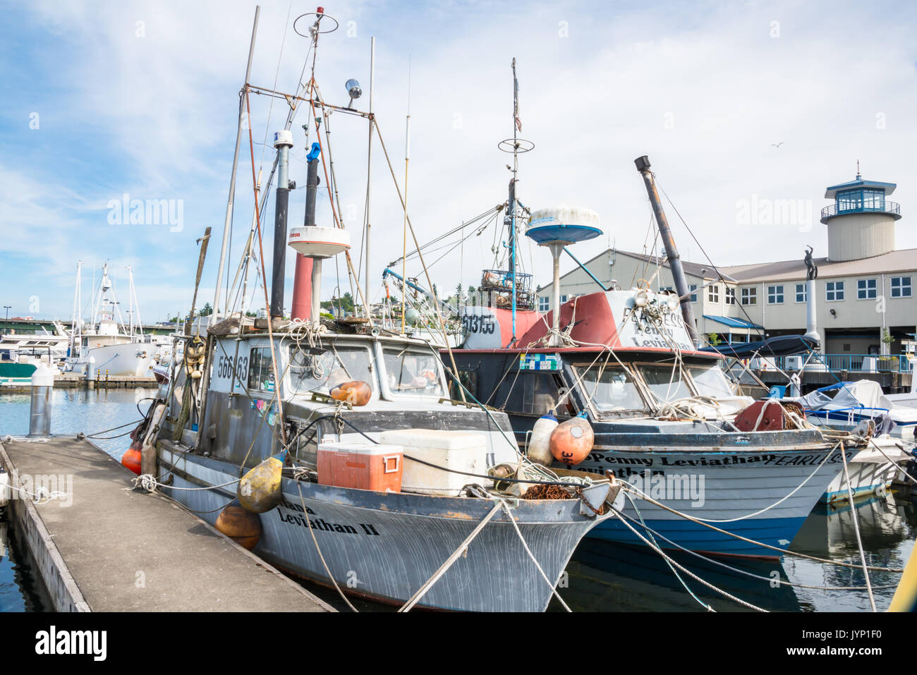 Two Old Fishing Vessels Docked at Port of Seattle Fishermen's Terminal Stock Photo