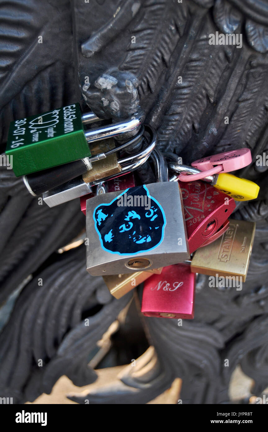 Padlocks engraved with the names of lovers, locked onto the wrought