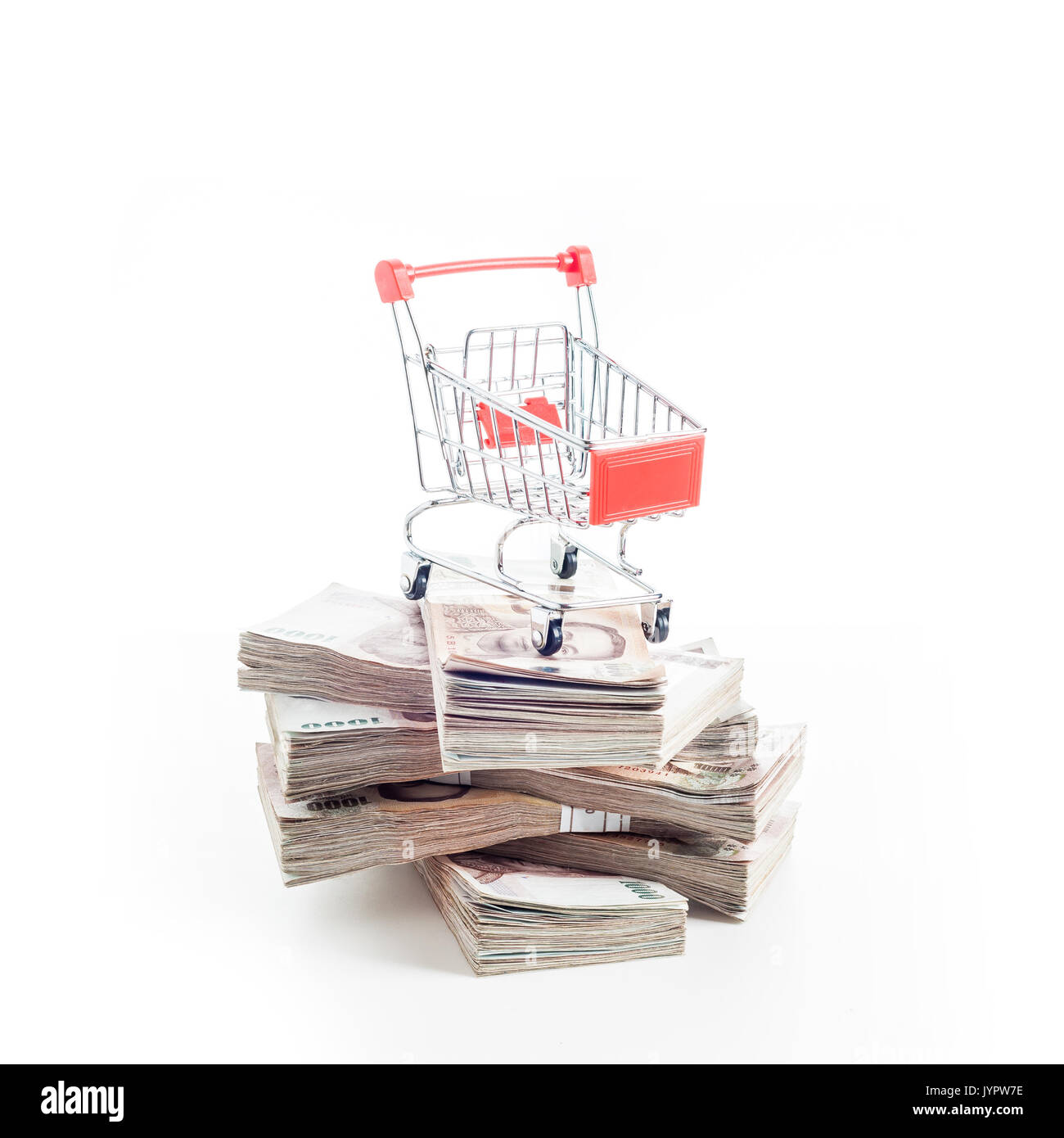 shopping cart on Thai baht (THB) banknotes. Thailand currency. Stock Photo