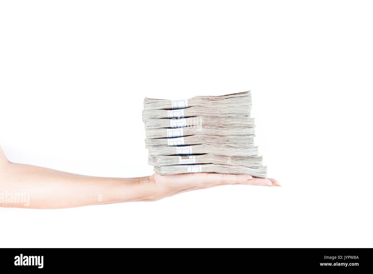 Heap of Banknotes in hand of woman. Concept of income or investment Stock Photo