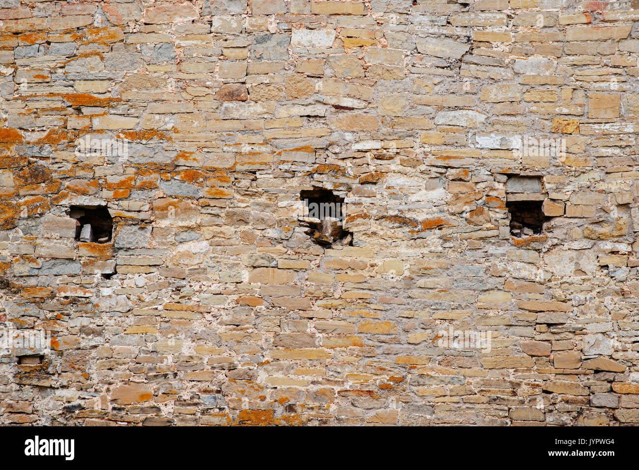 Texture Of Old Medieval Castle Wall With Loophole Made From Gray Stones