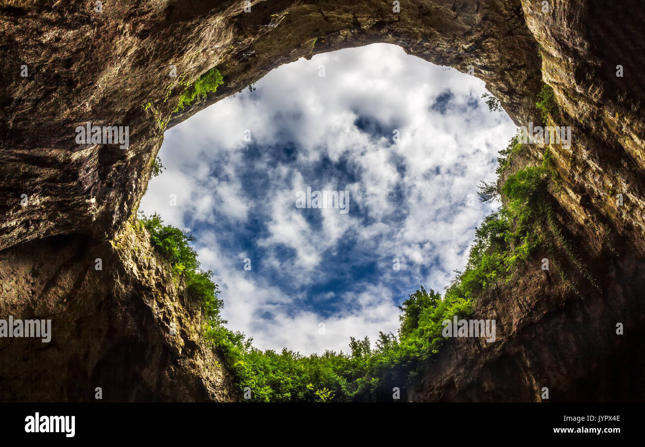Sky Through Under The Cave. Devetashka Cave Situated In North Bulgaria Stock Photo