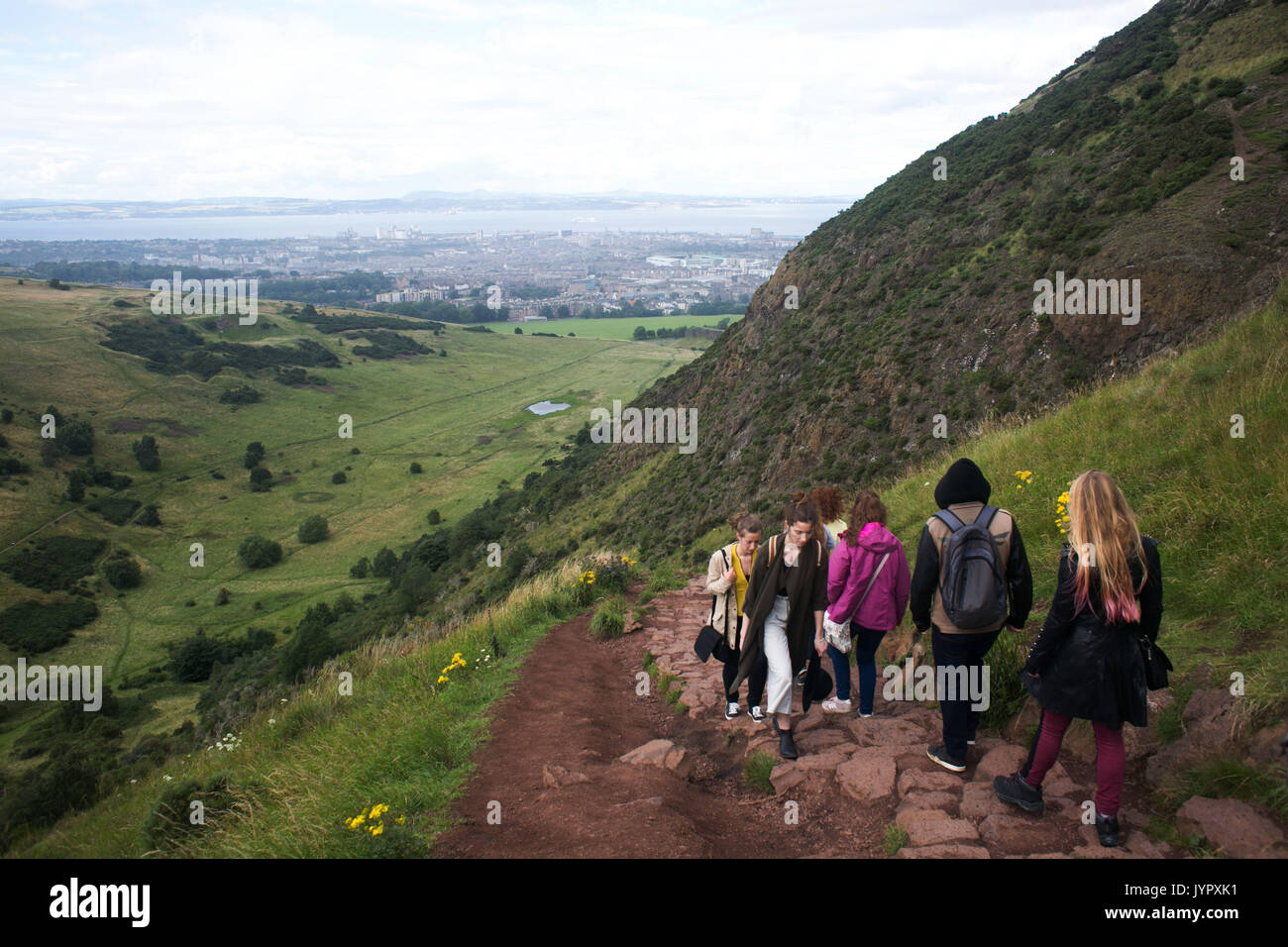 The peak of King Arthur's Seat is a popular destination for both locals and tourists. The peak and surrounding rocky hills are remnants of vulcanic ro Stock Photo