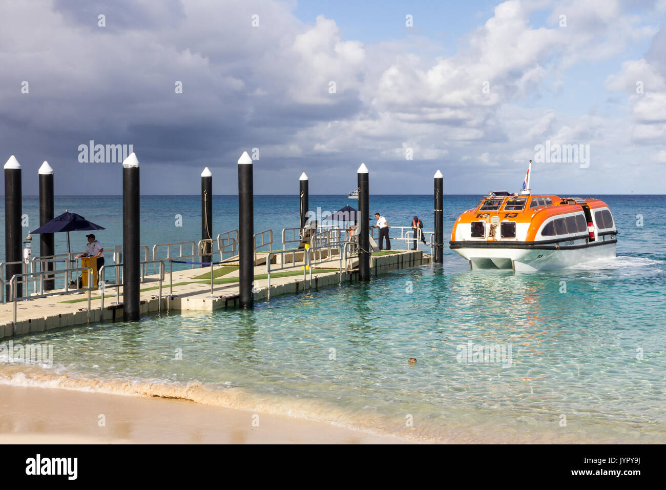 Tender from the Holland America line cruise ship arriving at the dock on Dravuni island, Fiji Stock Photo