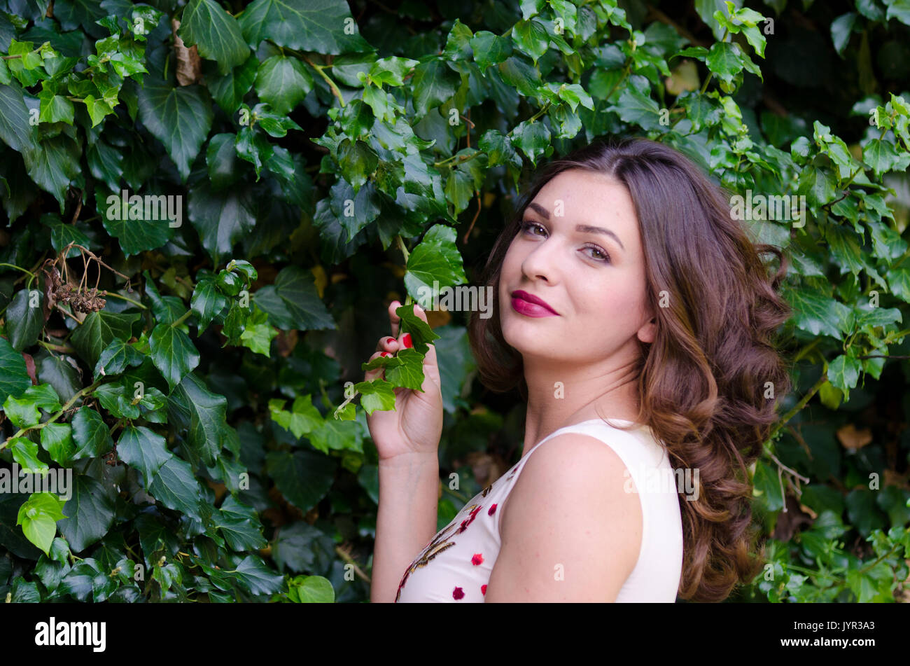 Portrait of a beautiful young girl on nature Stock Photo - Alamy