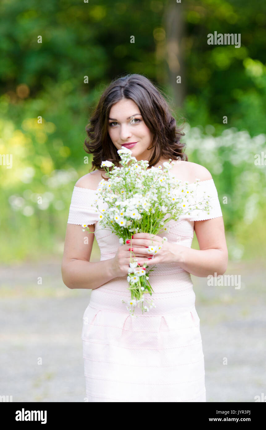 Portrait of a beautiful young girl on nature Stock Photo - Alamy