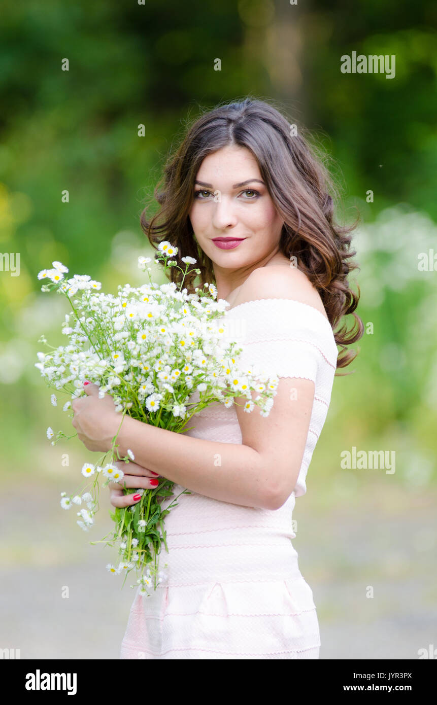 Portrait of a beautiful young girl on nature Stock Photo - Alamy