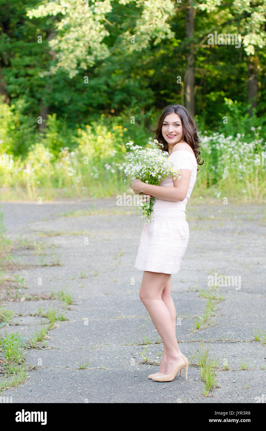 Portrait of a beautiful young girl on nature Stock Photo - Alamy