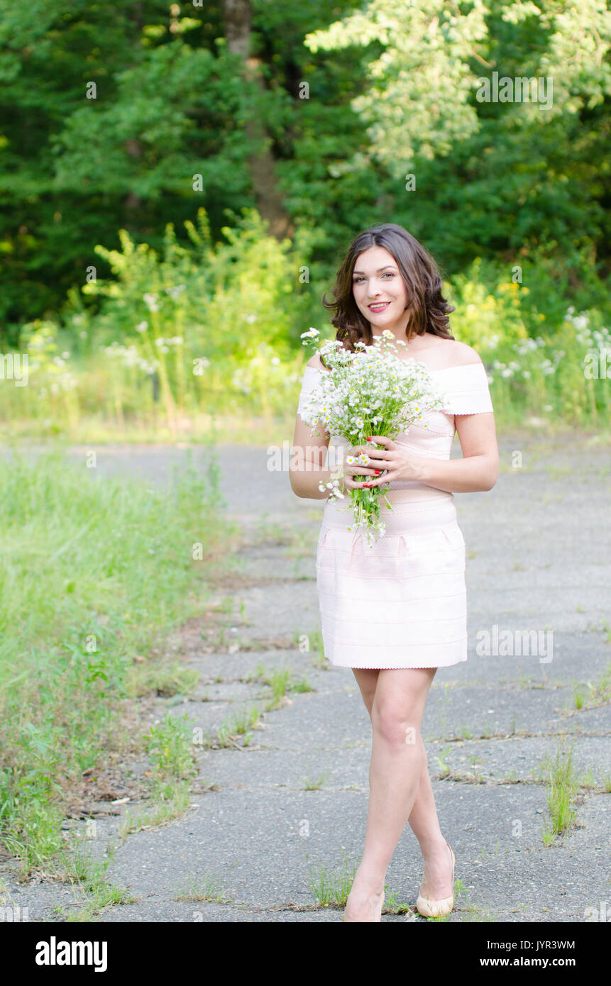 Portrait of a beautiful young girl on nature Stock Photo - Alamy
