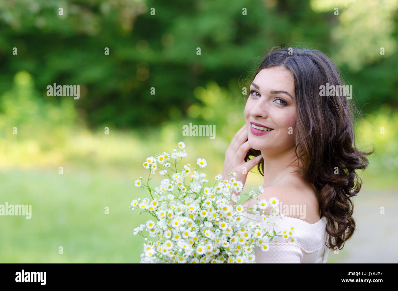 Portrait of a beautiful young girl on nature Stock Photo - Alamy