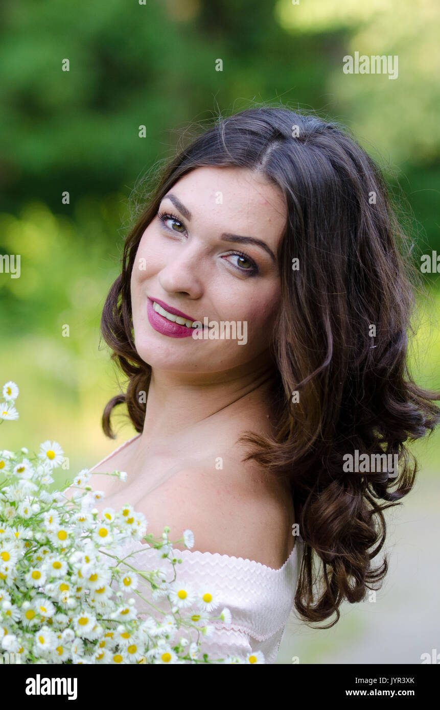Portrait of a beautiful young girl on nature Stock Photo - Alamy