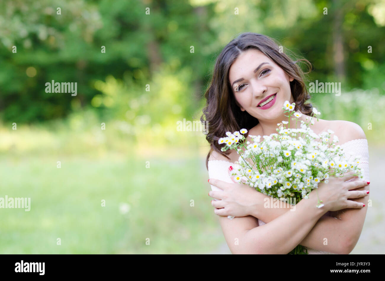 Portrait of a beautiful young girl on nature Stock Photo - Alamy