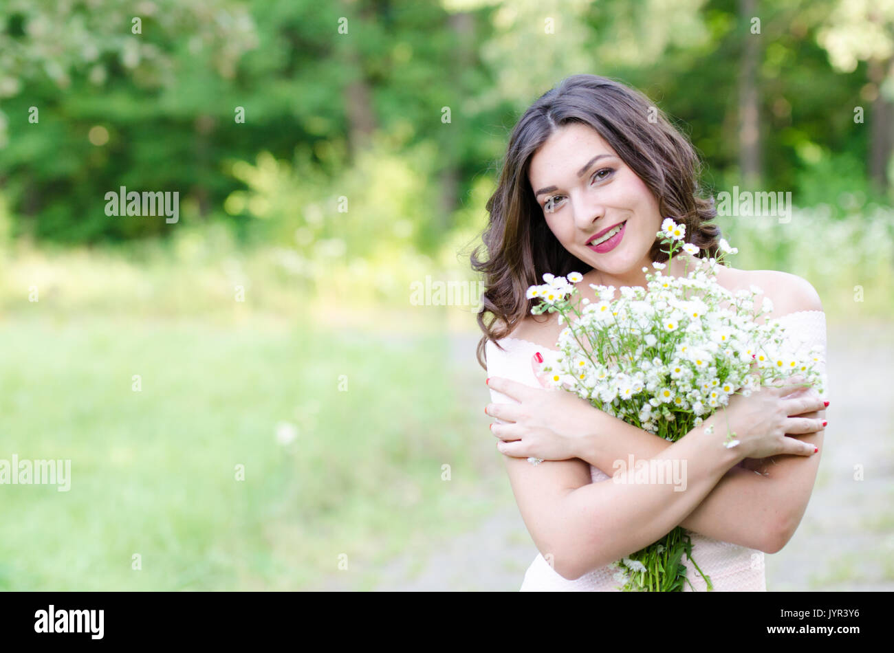 Portrait of a beautiful young girl on nature Stock Photo - Alamy