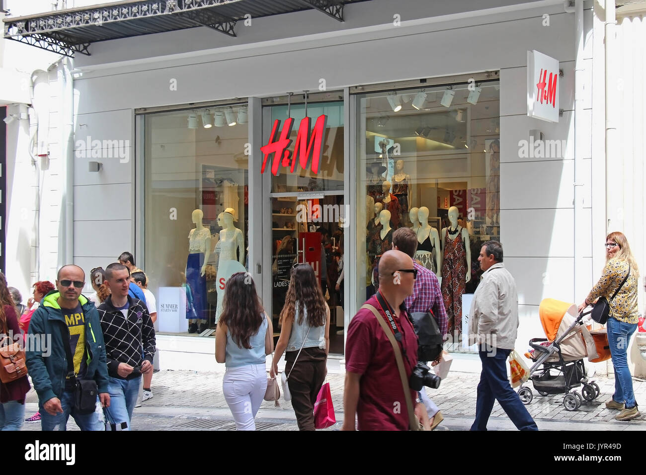 ATHENS, GREECE - May 02; Famous Ermou street shopping district with H&M  store and people walking around in Athens, Greece - May 02, 2015; Ermou  street Stock Photo - Alamy