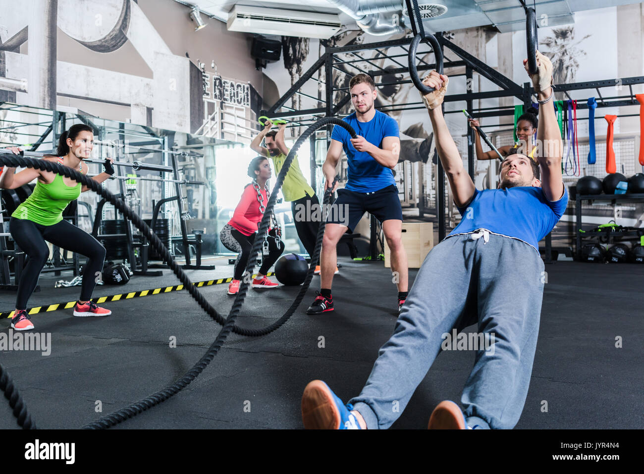 Men and women at functional fitness training in gym Stock Photo - Alamy
