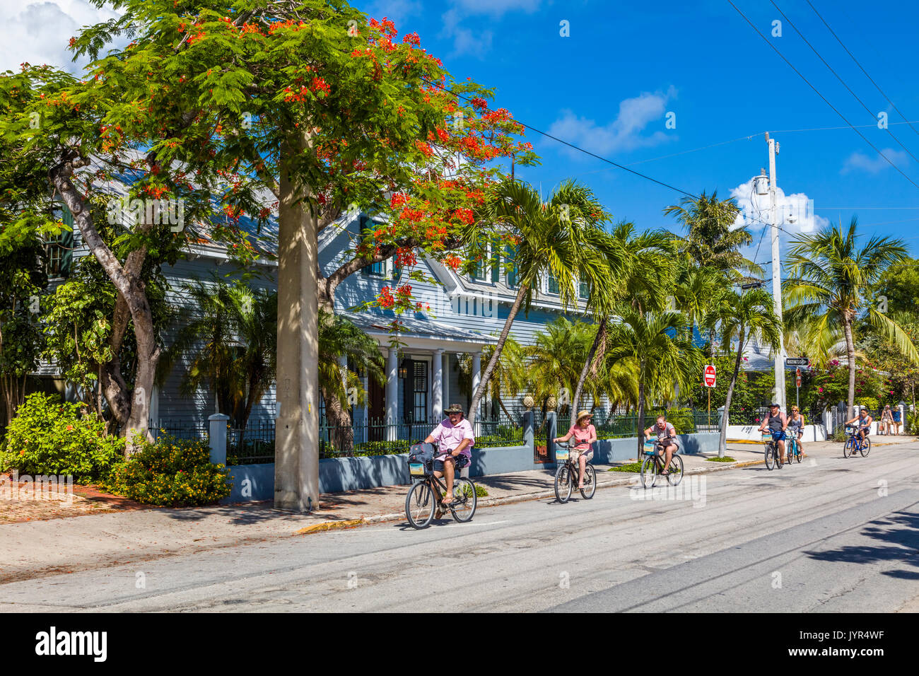 People riding bikes in Key West Florida Stock Photo