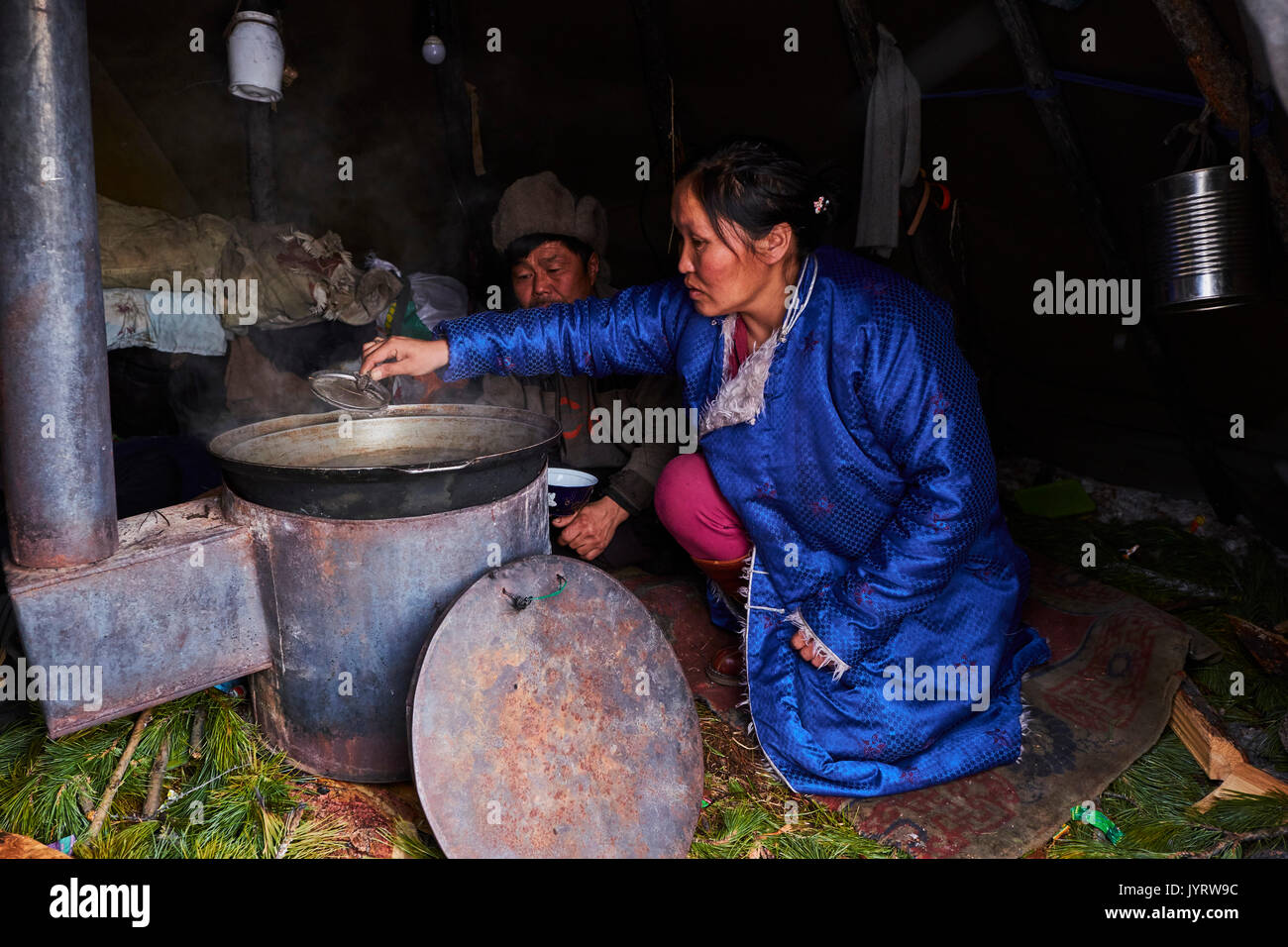 Mongolia, Khovsgol province, the Tsaatan, reindeer herder, the winter camp, cooking reindeer meat Stock Photo