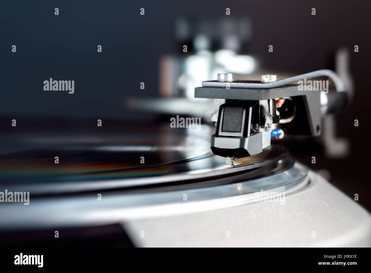 Turntable with black Headshell Cartridge in action, dj, audio Stock