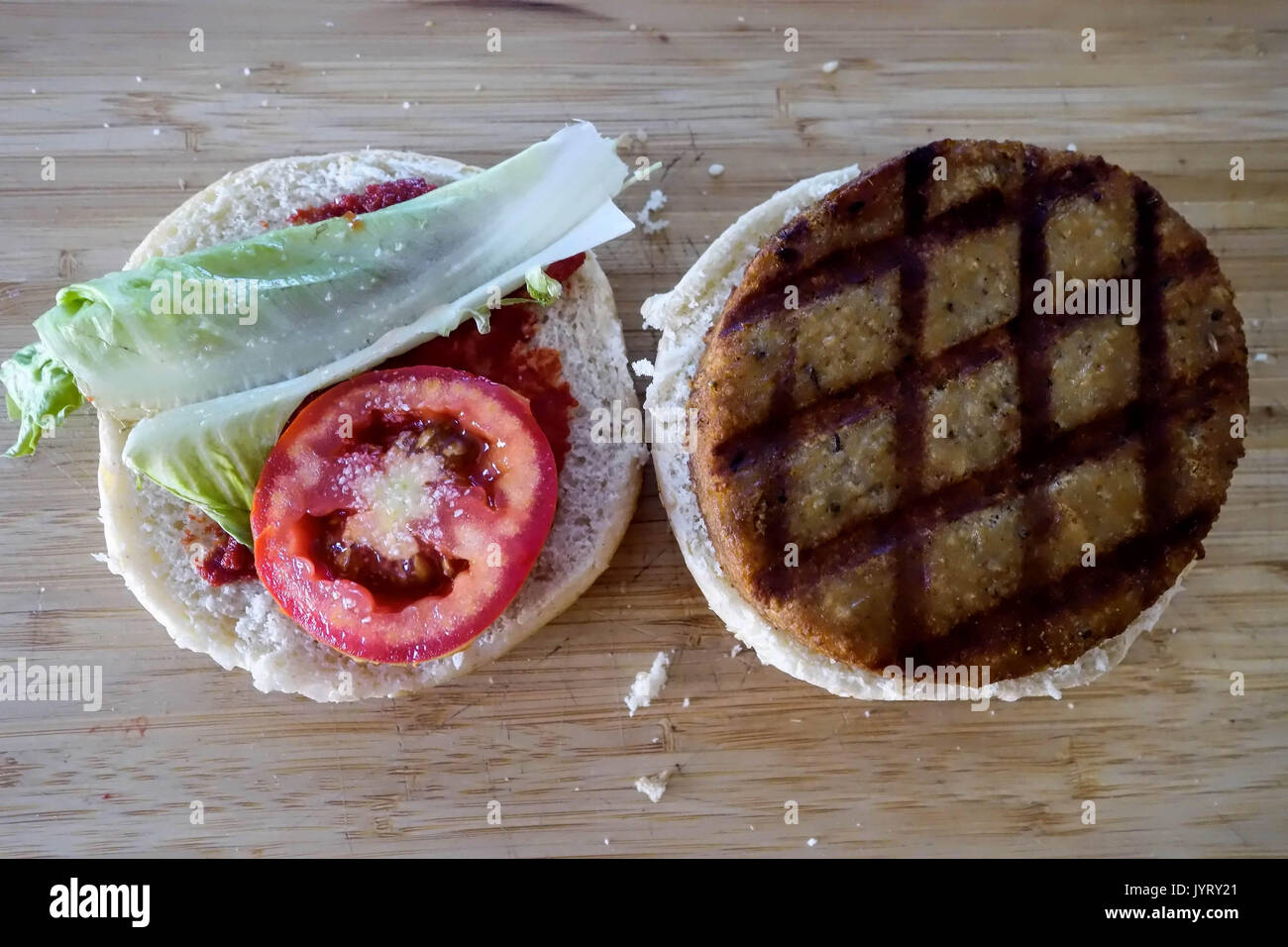 Preparation of a fresh Chicken Burger Stock Photo Alamy