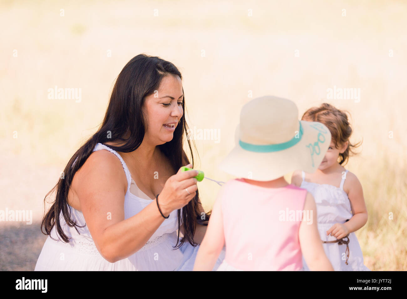 Playing with soap bubbles in the park Stock Photo - Alamy