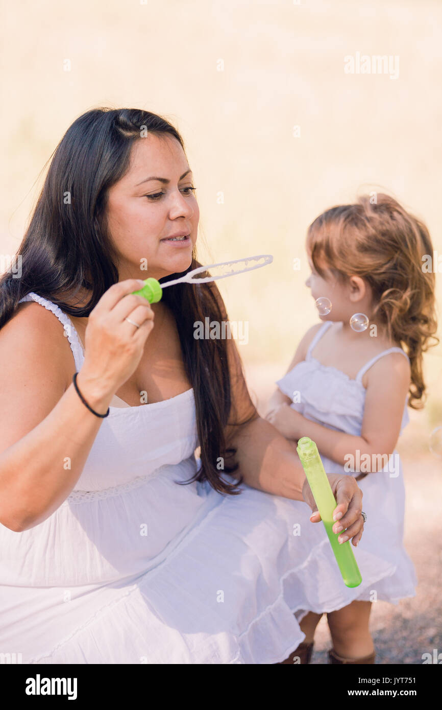 Playing with soap bubbles in the park Stock Photo - Alamy