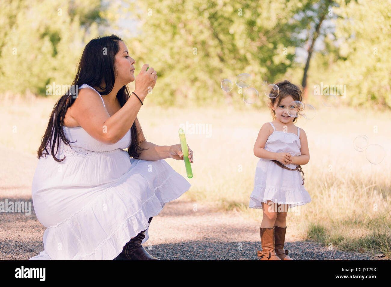 Playing with soap bubbles in the park Stock Photo - Alamy