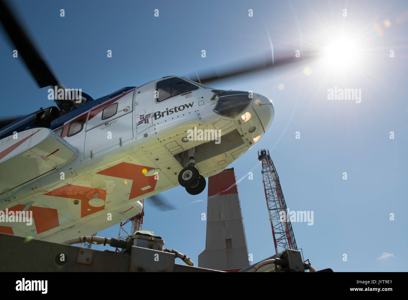 Bristow Helicopter, landing on a north sea oil and gas platform. credit: LEE RAMSDEN / ALAMY Stock Photo