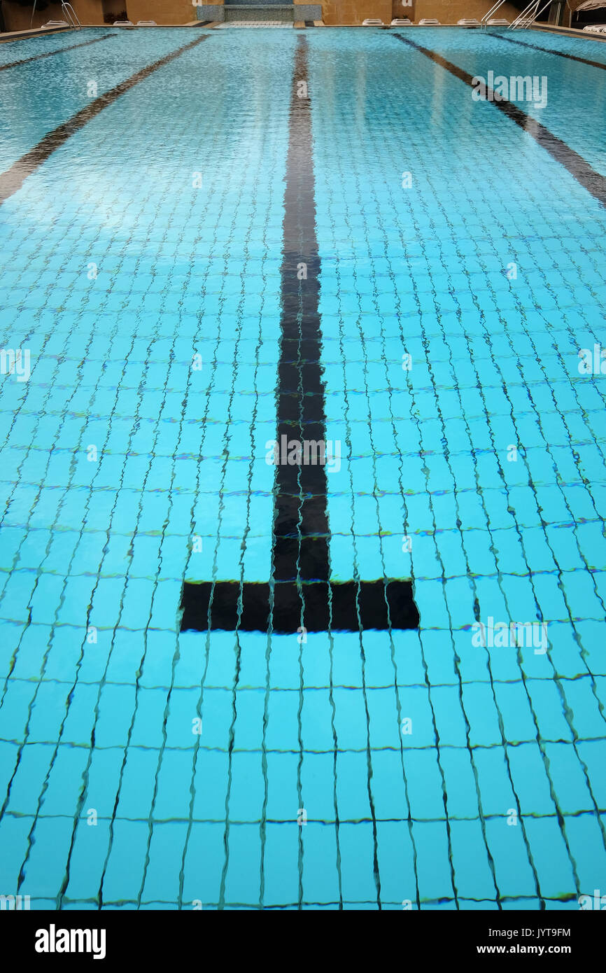 Above view of quiet water surface and lane in swimming pool Stock Photo