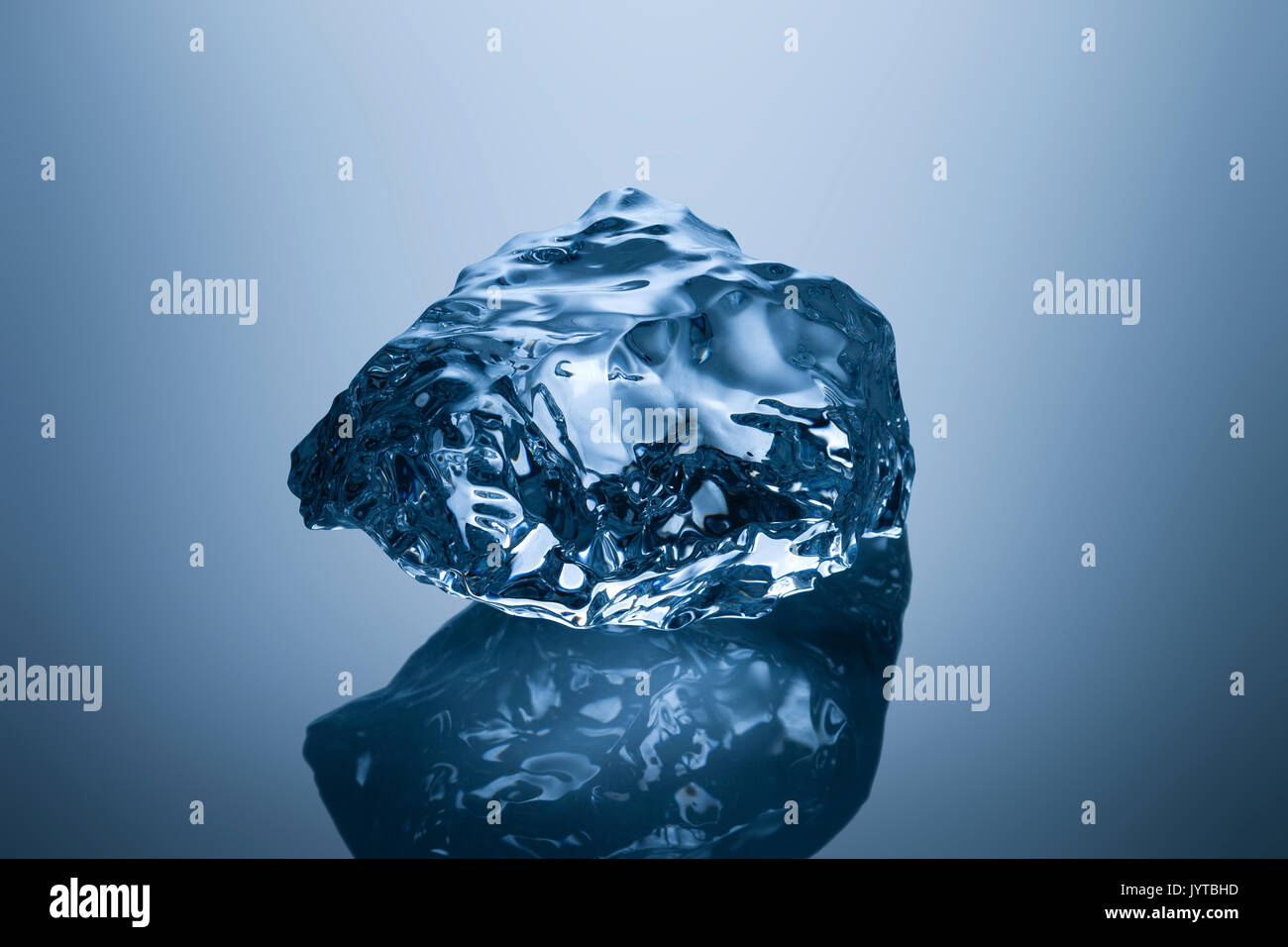Photo of a professionally formed piece of ice on reflecting surface ...