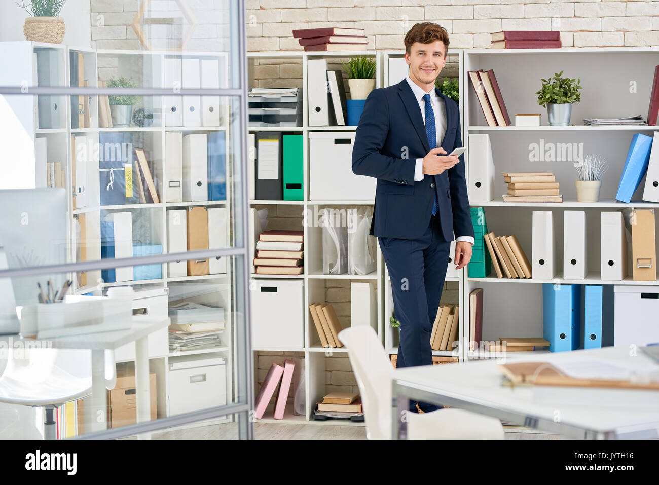 Handsome Businessman Posing in Office Stock Photo