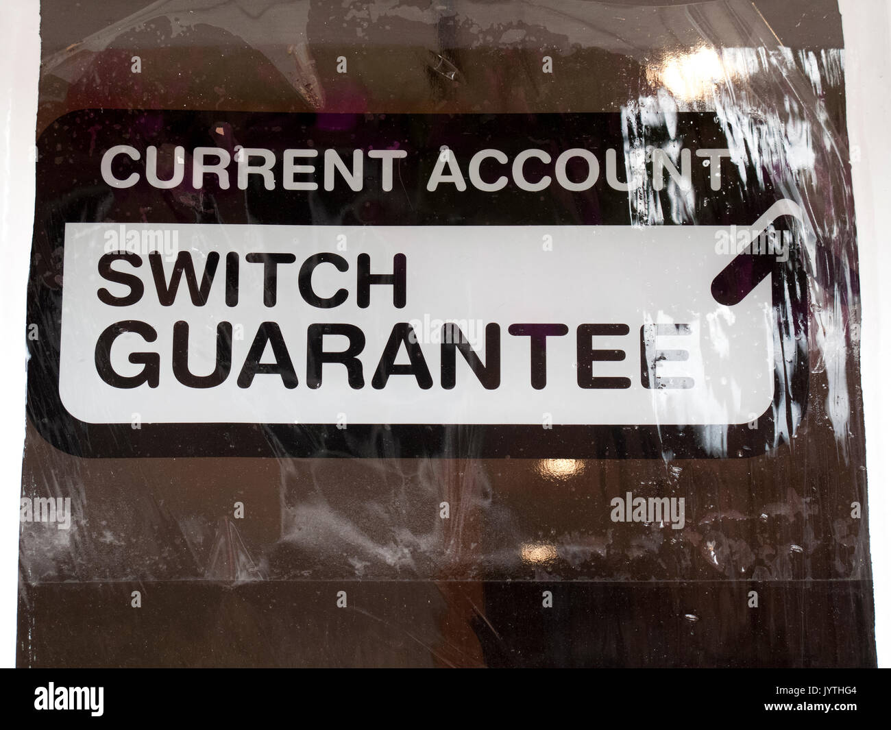 Current account switch guarantee sign in bank window, service to make switching accounts between banks hassle free within 7 days Stock Photo
