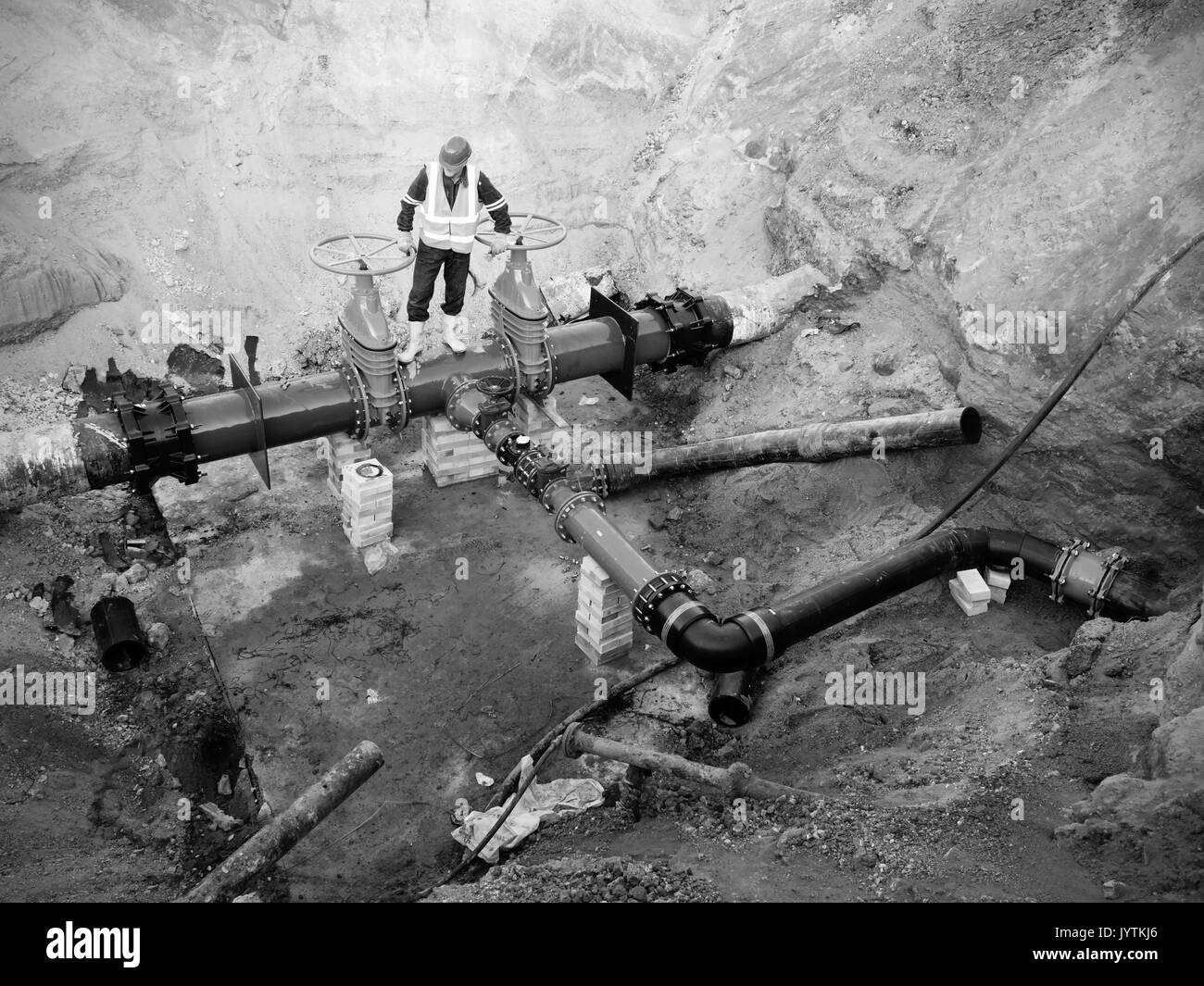 Technical expert underground at gate valve on 500mm drink water pipes