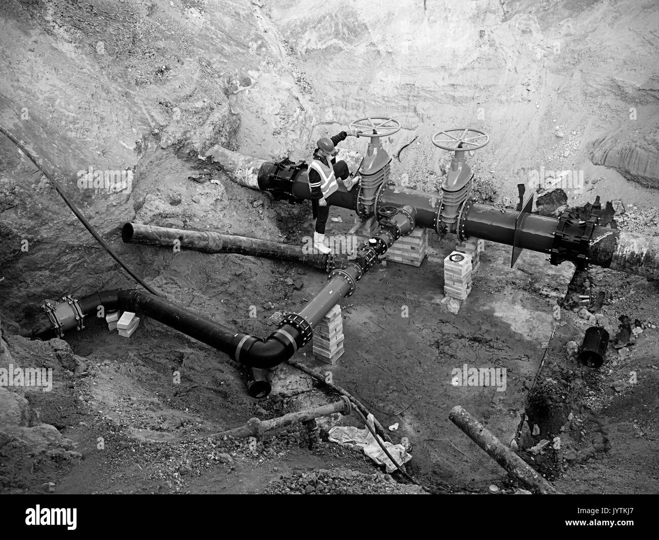 Technical expert underground at gate valve on 500mm drink water pipes