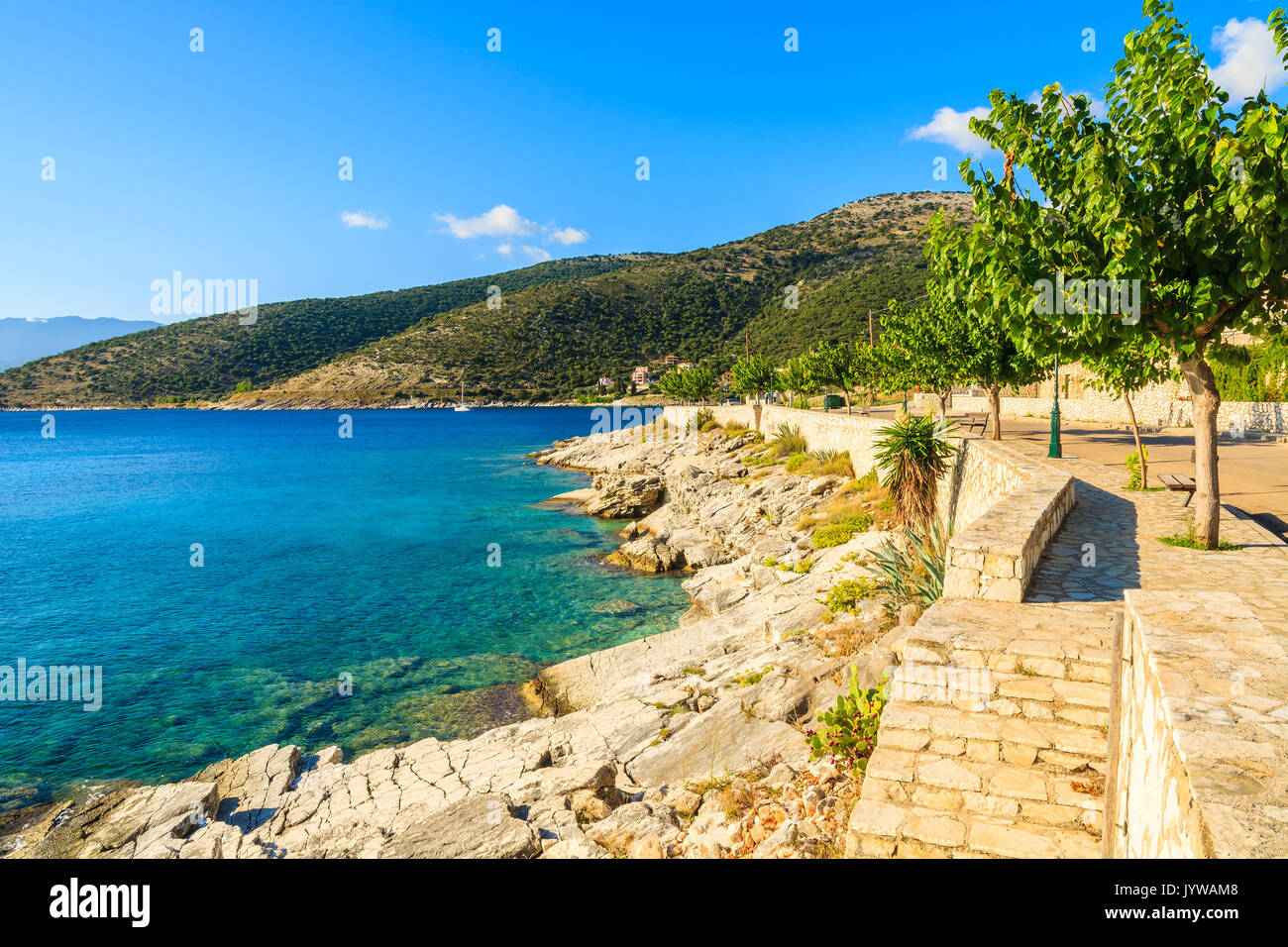 Coastal path with agave plants along sea in Agia Efimia village, Kefalonia island, Greece Stock Photo