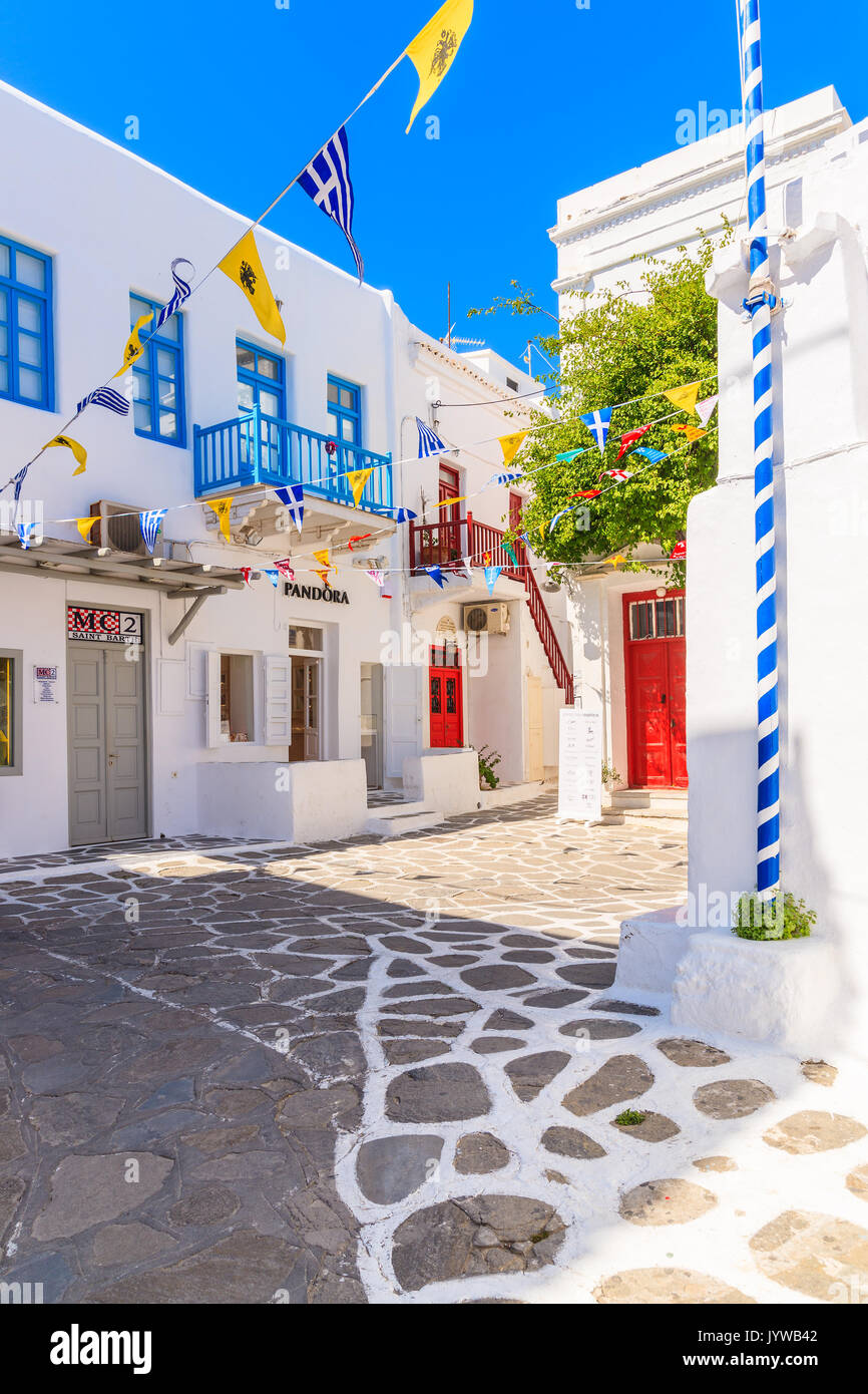 MYKONOS TOWN, GREECE - MAY 17, 2016: Typical street of beautiful Mykonos town with white and blue Greek architecture, Cyclades islands, Greece. Stock Photo