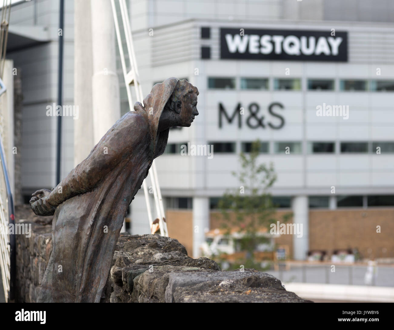 Sculpture of former mayor John Le Fleming on Southampton bridge with Westquay shopping centre Marks and Spencer store and logo in the background. Stock Photo